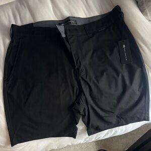 (3) pair Travis Mathew Wanderlust Shorts 9” inseam. 33 waist. Black, Grey, Navy.